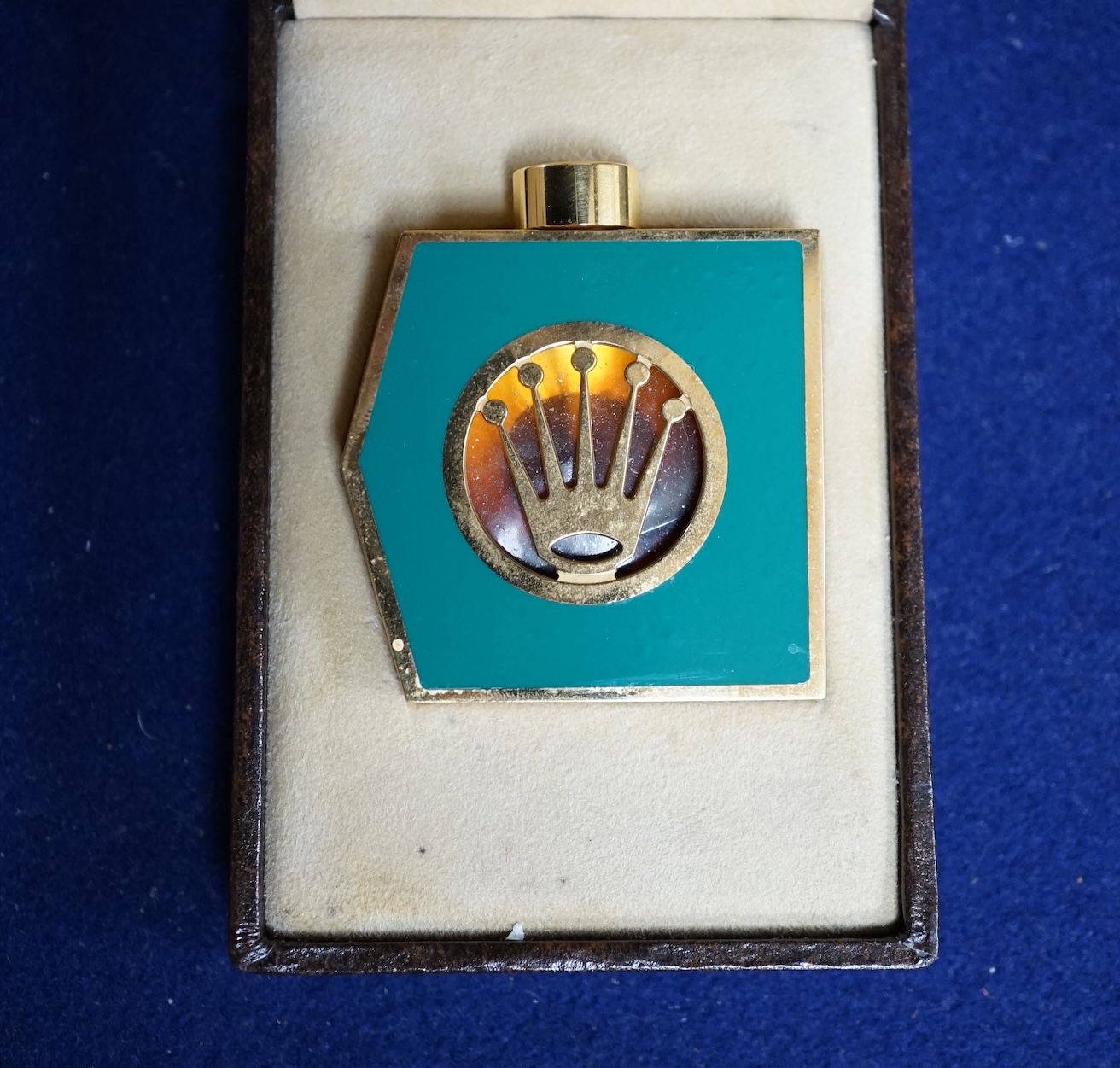 A Rolex “Perpetually Yours” enamelled scent bottle, boxed. Condition - fair to good